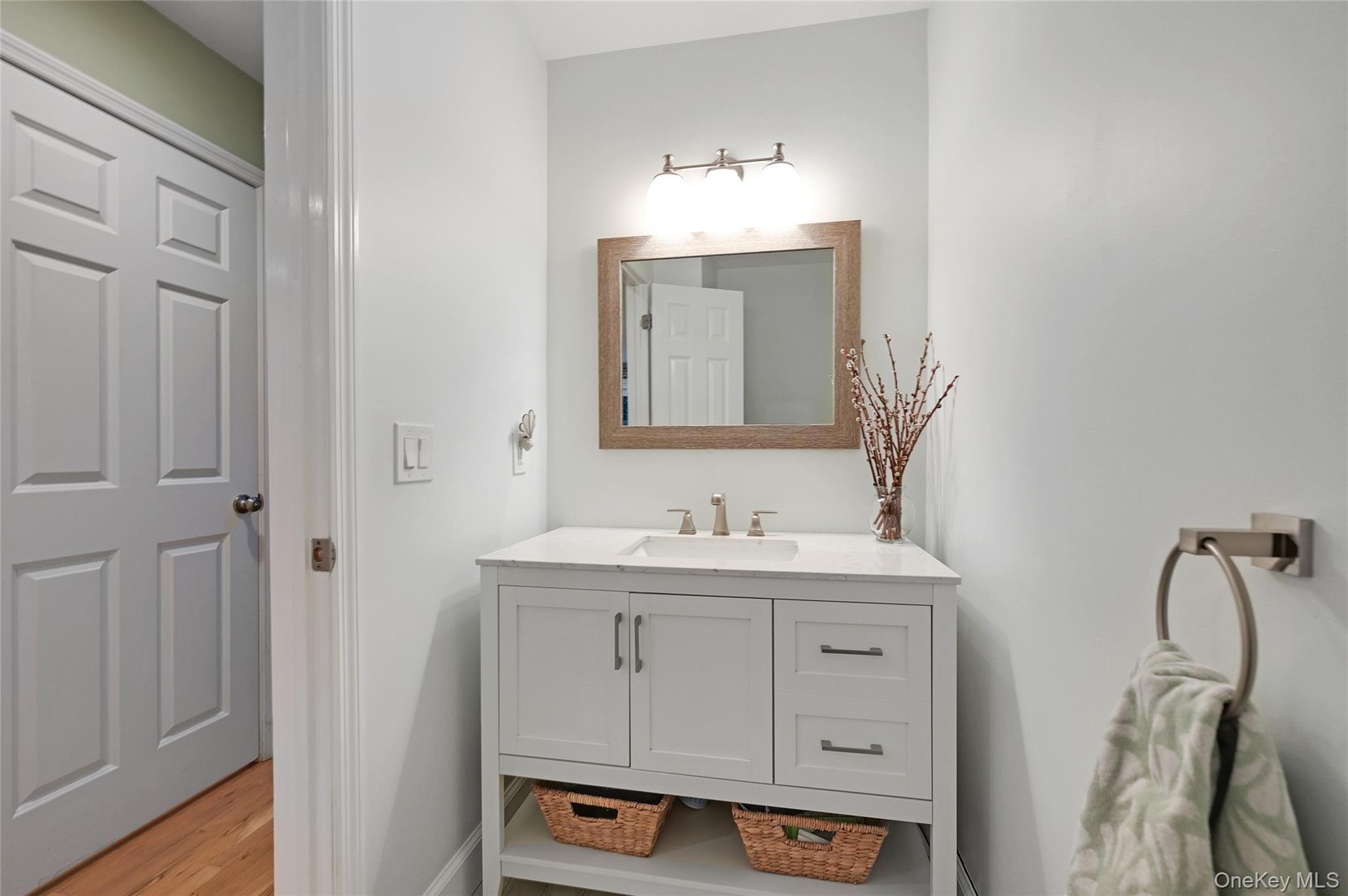 9 North Quarter Road Westhampton, NY 11977 - Photo 13 of 38 a bathroom with a sink and a mirror