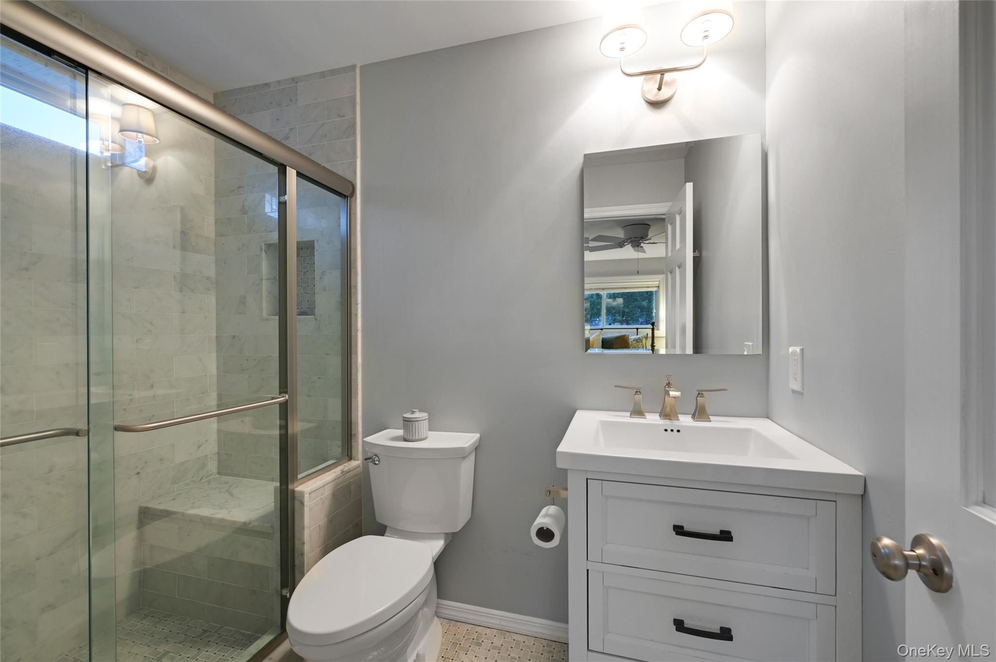 9 North Quarter Road Westhampton, NY 11977 - Photo 15 of 38 a bathroom with a sink a toilet and shower