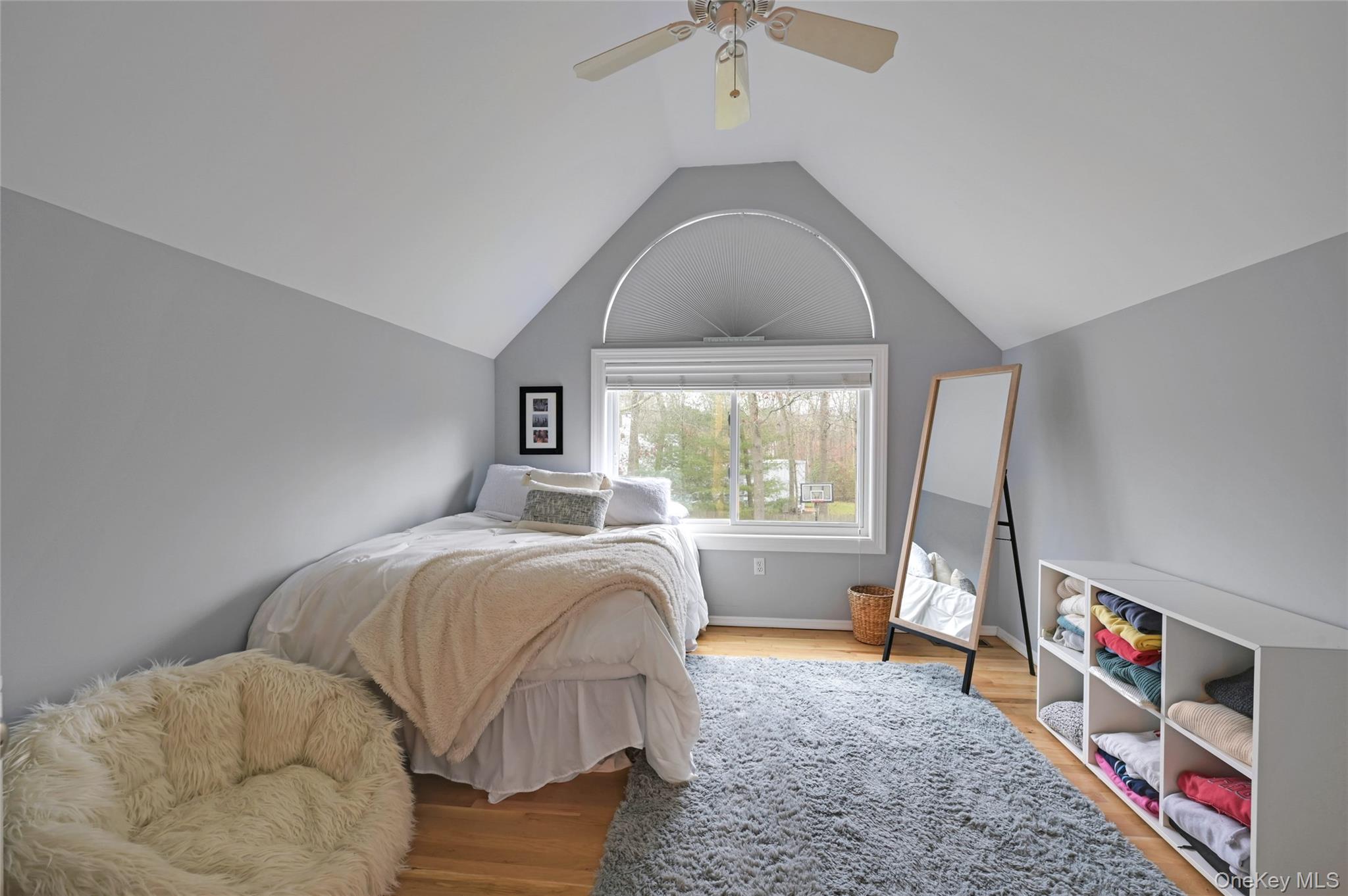 9 North Quarter Road Westhampton, NY 11977 - Photo 16 of 38 a bed sitting in a bedroom next to a window