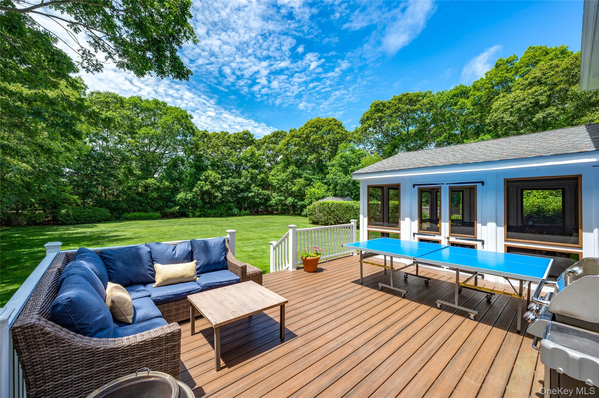 9 North Quarter Road Westhampton, NY 11977 - Photo 22 of 38 a view of house with deck outdoor seating and green space