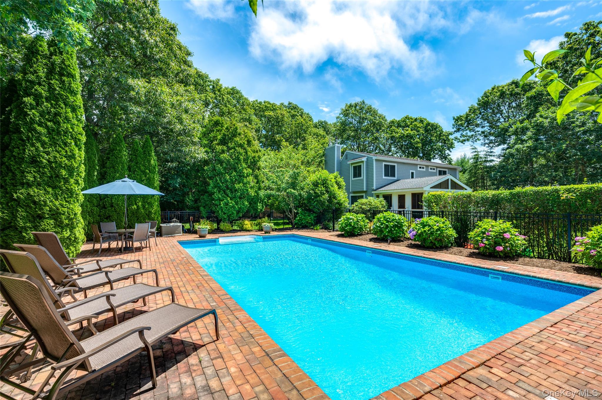 9 North Quarter Road Westhampton, NY 11977 - Photo 33 of 38 a view of a swimming pool with lounge chair