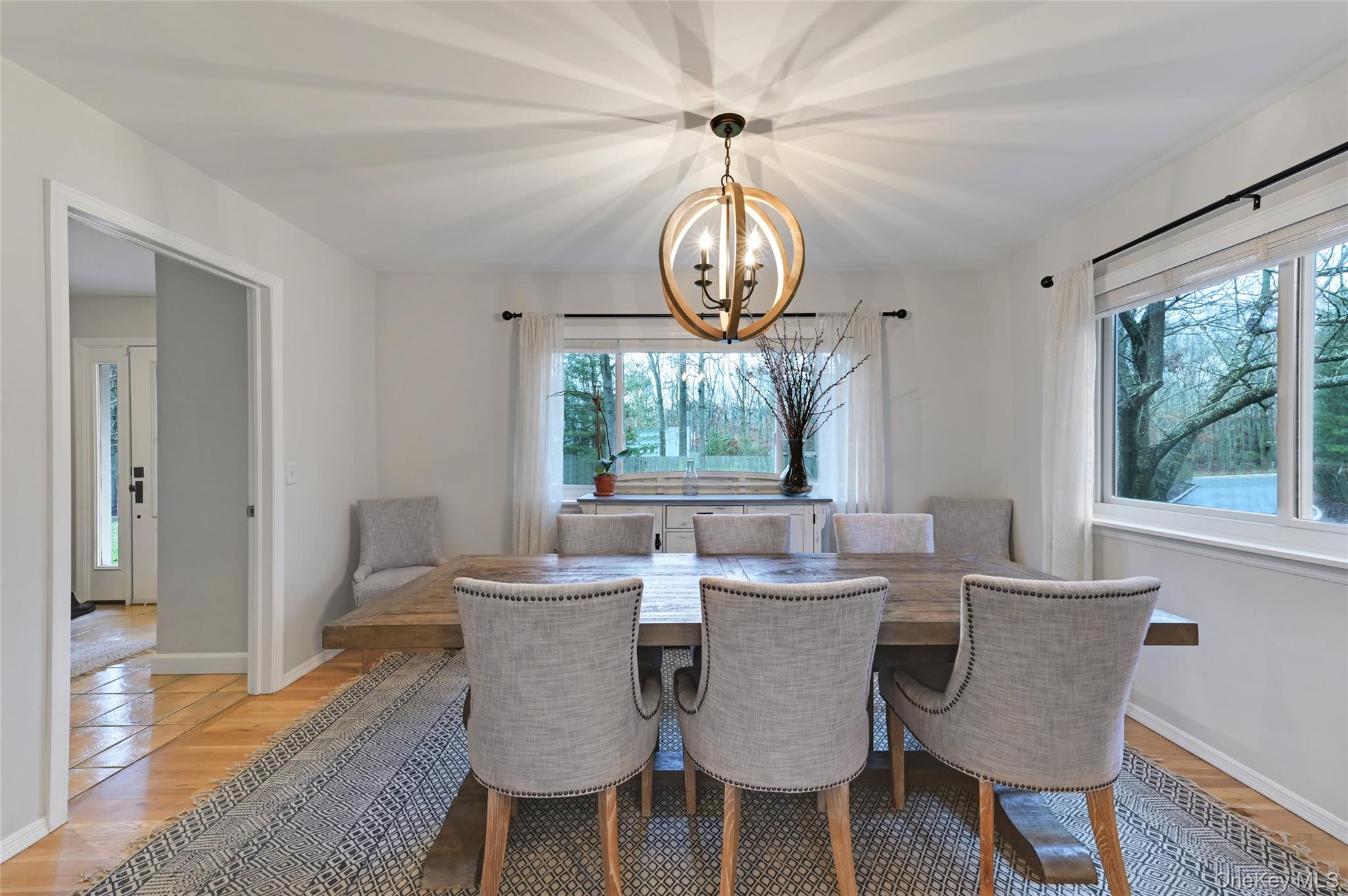 9 North Quarter Road Westhampton, NY 11977 - Photo 9 of 38 a view of a dining room with furniture window and wooden floor