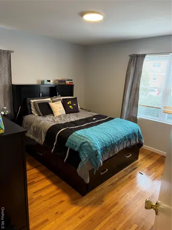 a bedroom with a bed and a closet