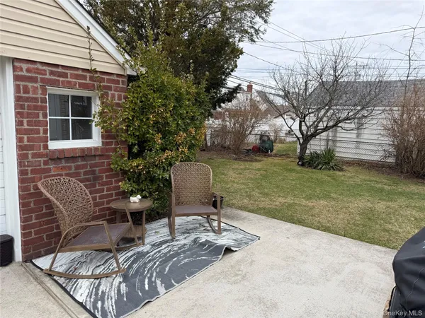 a backyard of a house with seating space