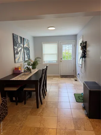 a view of a dining room with furniture