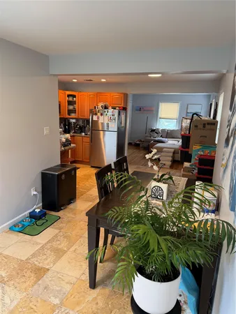 a living room with furniture a patio and a window