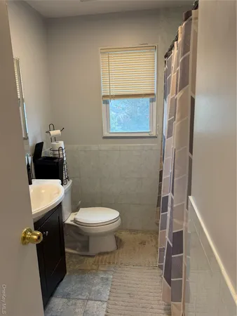 a bedroom with bed and furniture