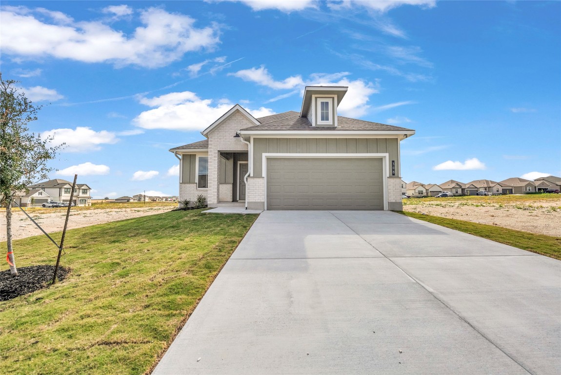 308 Boatright Boulevard Jarrell, TX 76537 - Photo 2 of 31 a view of a patio with a yard