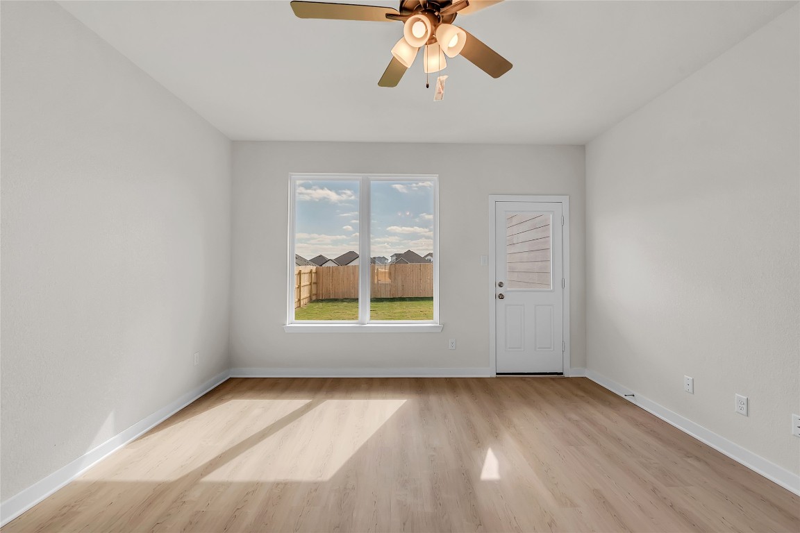 308 Boatright Boulevard Jarrell, TX 76537 - Photo 23 of 31 wooden floor in an empty room with a window
