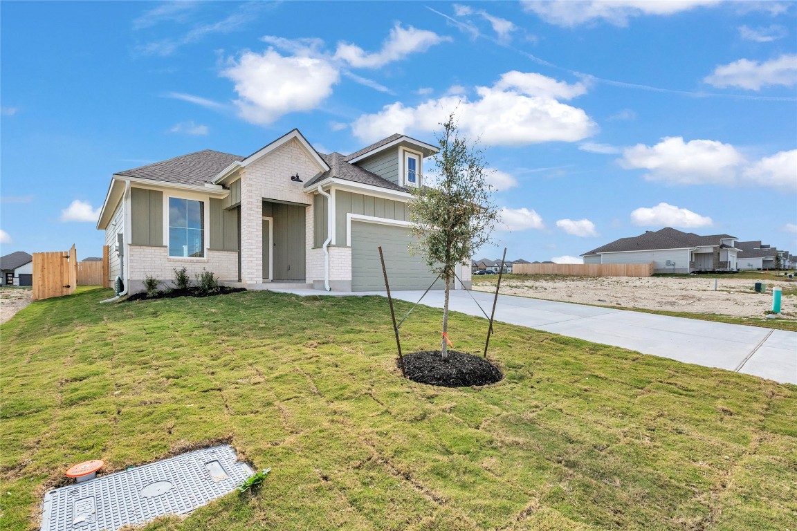 308 Boatright Boulevard Jarrell, TX 76537 - Photo 5 of 31 a front view of a house with a yard