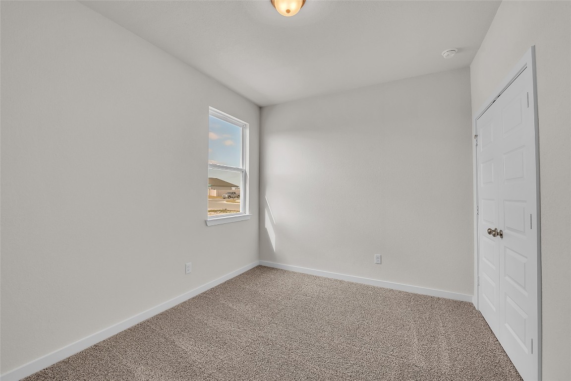 308 Boatright Boulevard Jarrell, TX 76537 - Photo 6 of 31 a view of an empty room with a window