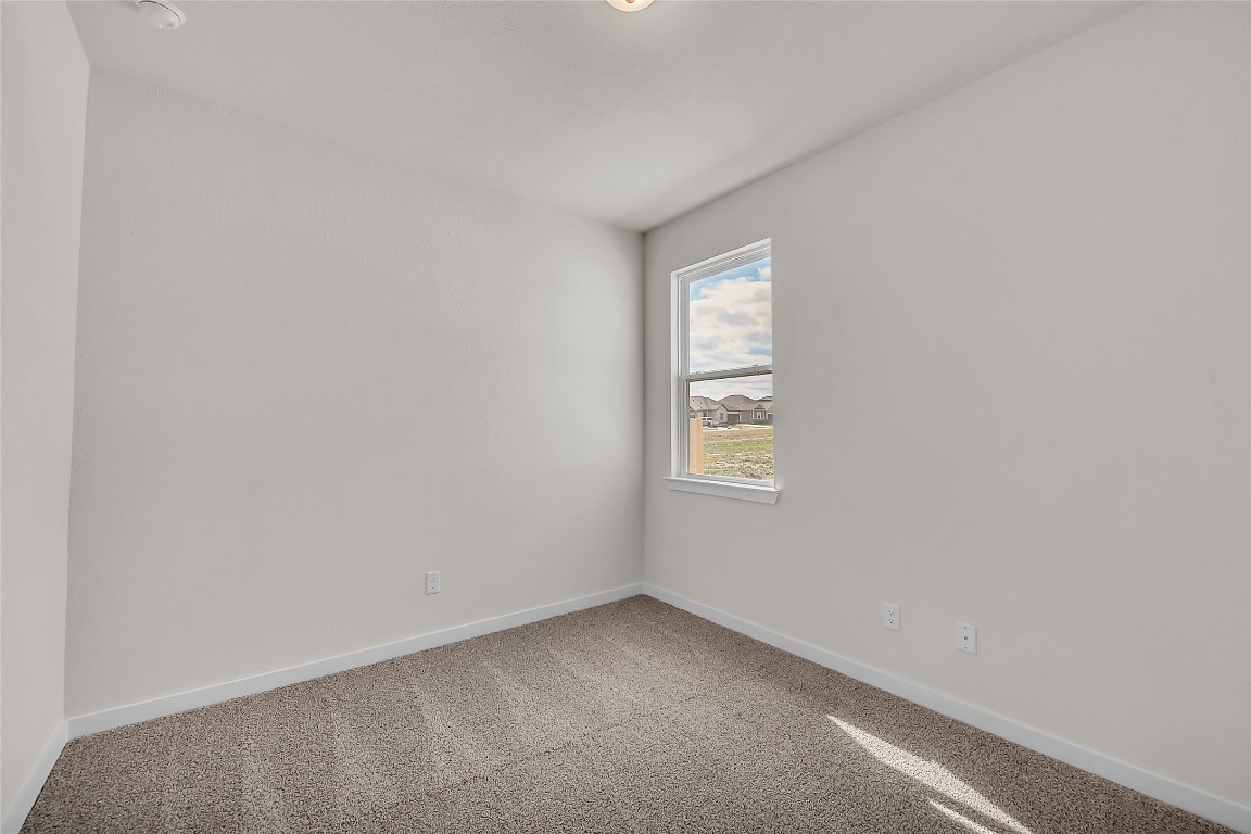 308 Boatright Boulevard Jarrell, TX 76537 - Photo 8 of 31 a view of an empty room with a window