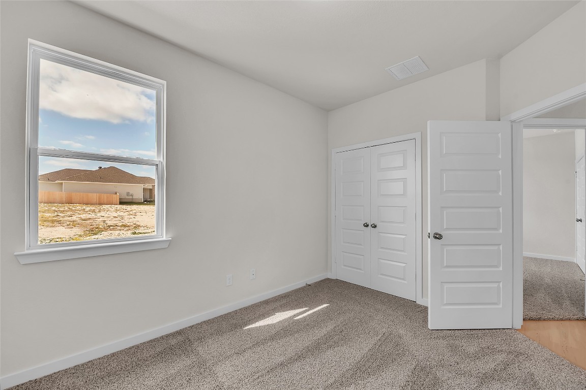 308 Boatright Boulevard Jarrell, TX 76537 - Photo 9 of 31 a view of a small space with wooden floor and a window