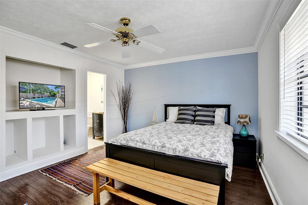 1415 Miami Road, Unit B Fort Lauderdale, FL 33316 - Photo 25 of 59 a bedroom with a bed and a window