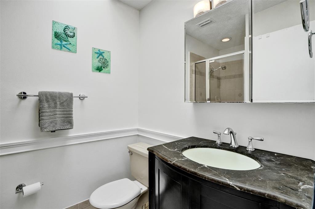 1415 Miami Road, Unit B Fort Lauderdale, FL 33316 - Photo 29 of 59 a bathroom with a granite countertop sink and a mirror