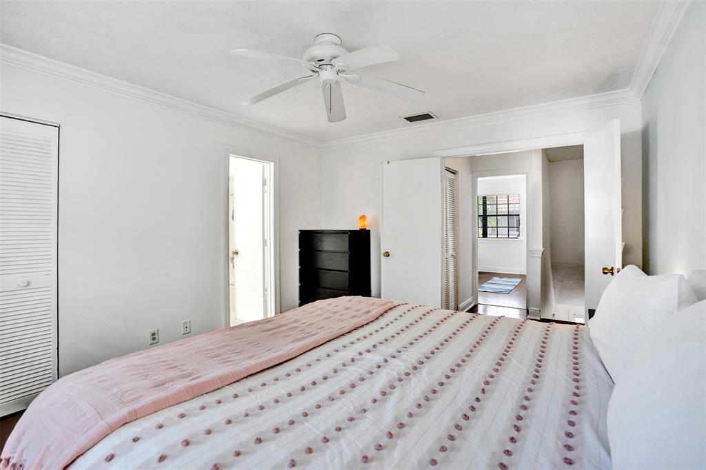 1415 Miami Road, Unit B Fort Lauderdale, FL 33316 - Photo 35 of 59 a bedroom with a large bed and a chandelier