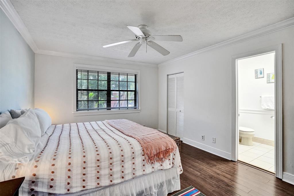 1415 Miami Road, Unit B Fort Lauderdale, FL 33316 - Photo 36 of 59 a bedroom with a bed and a window