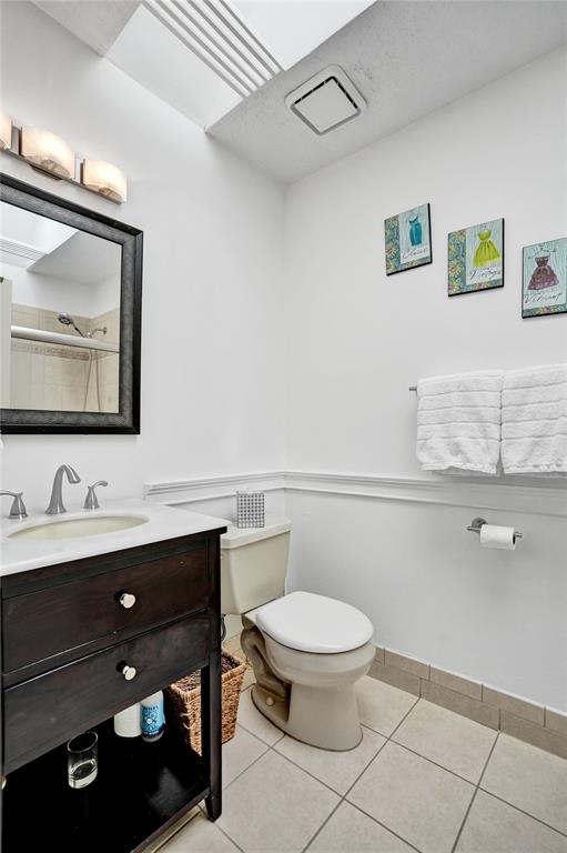 1415 Miami Road, Unit B Fort Lauderdale, FL 33316 - Photo 40 of 59 a bathroom with a toilet a sink and mirror