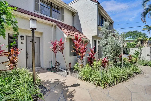 a kitchen with appliances a sink and cabinets