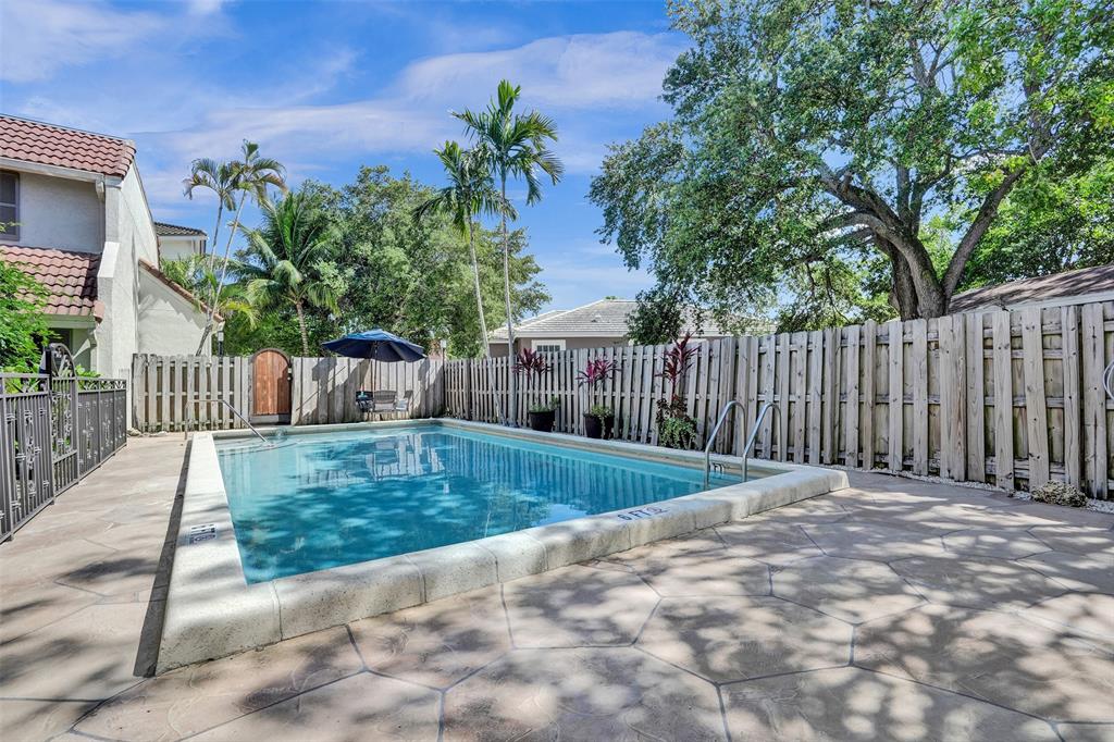 1415 Miami Road, Unit B Fort Lauderdale, FL 33316 - Photo 49 of 59 a view of a backyard with wooden fence