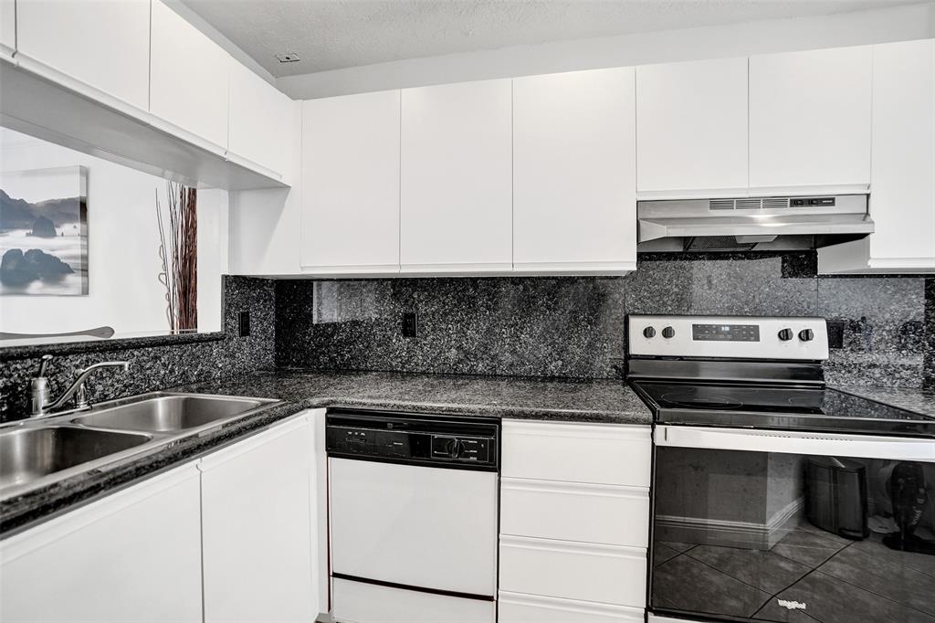 1415 Miami Road, Unit B Fort Lauderdale, FL 33316 - Photo 6 of 59 a kitchen with appliances a sink and cabinets