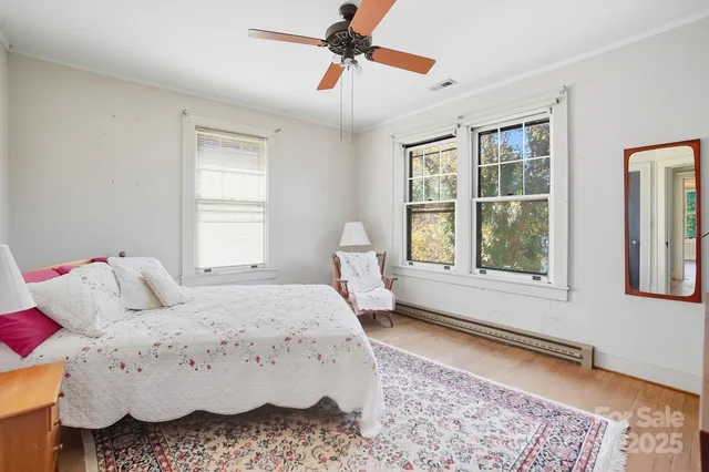 a bed room with a bed and a window