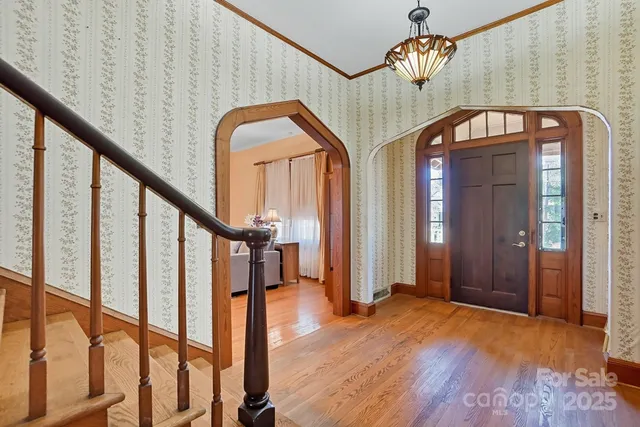 a view of an entryway with wooden floor