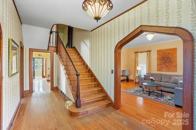 a view of front door with staircase