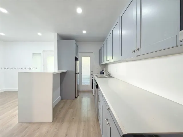 an empty room with wooden floor