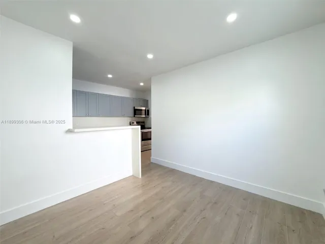 a view of kitchen and wooden floor