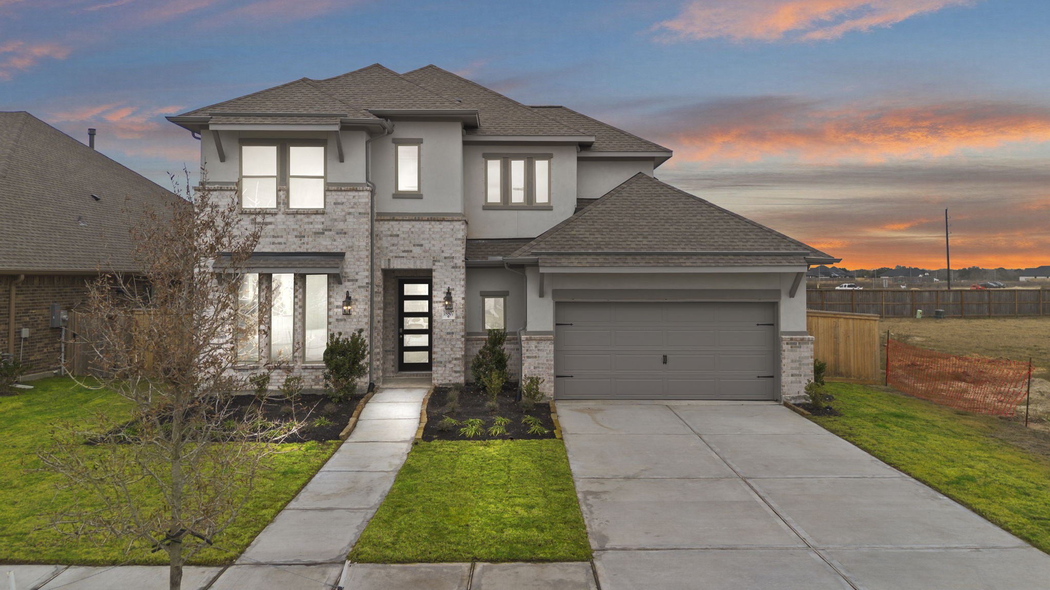 a front view of a house with yard