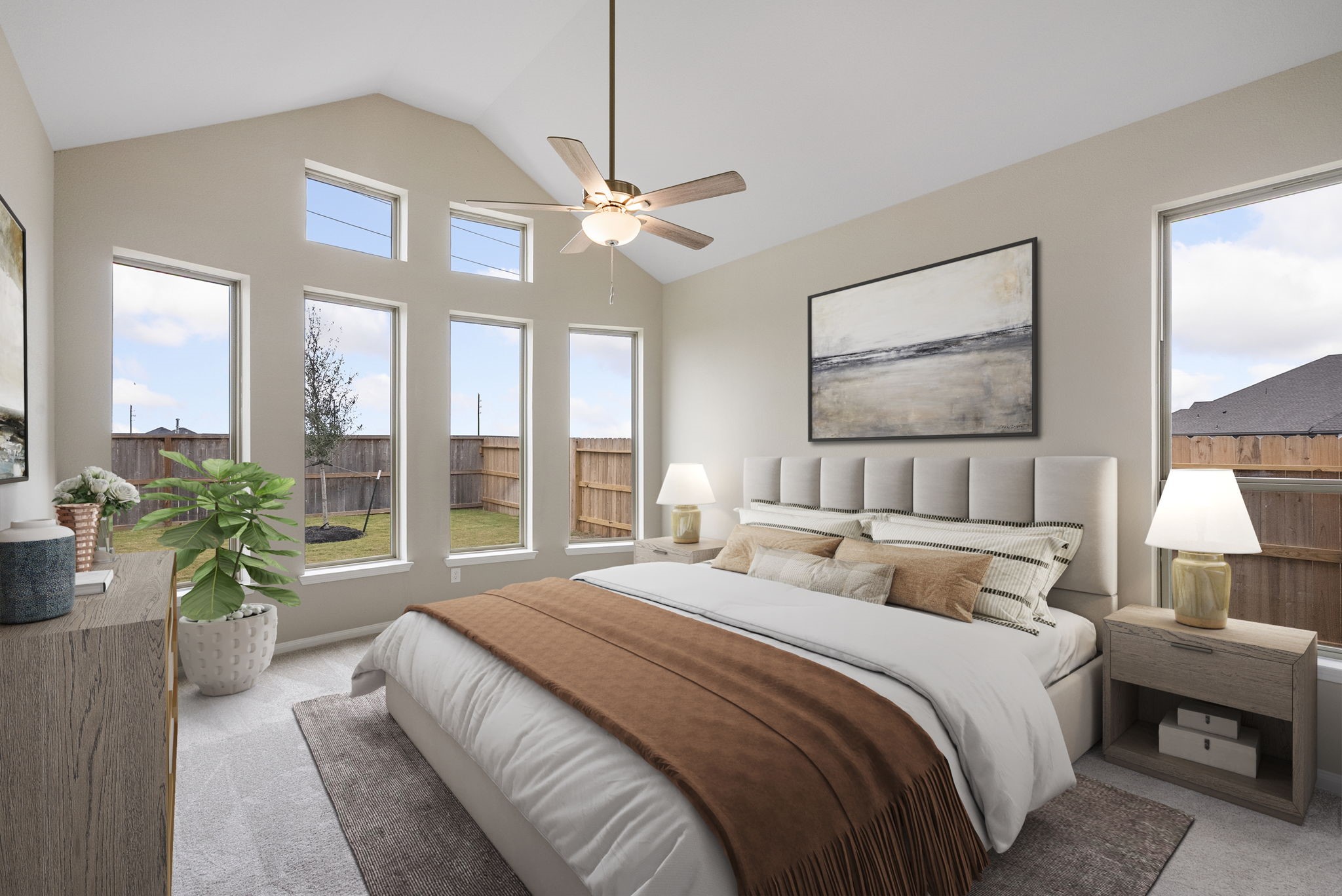 18807 Lima Orange Trail Manvel, TX 77578 - Photo 18 of 32 a bedroom with a large bed and a chandelier