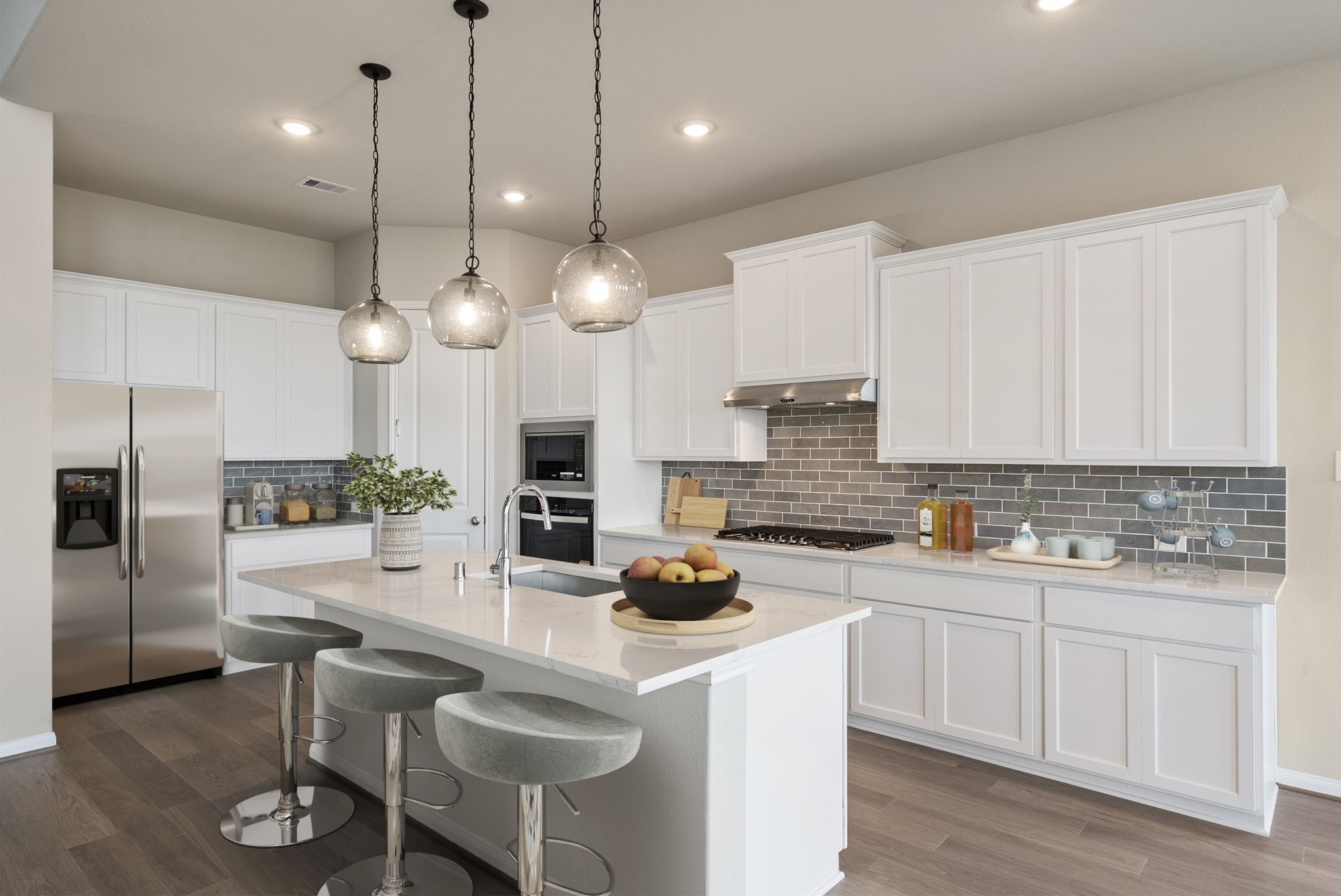 18807 Lima Orange Trail Manvel, TX 77578 - Photo 2 of 32 a kitchen with a sink stainless steel appliances and cabinets
