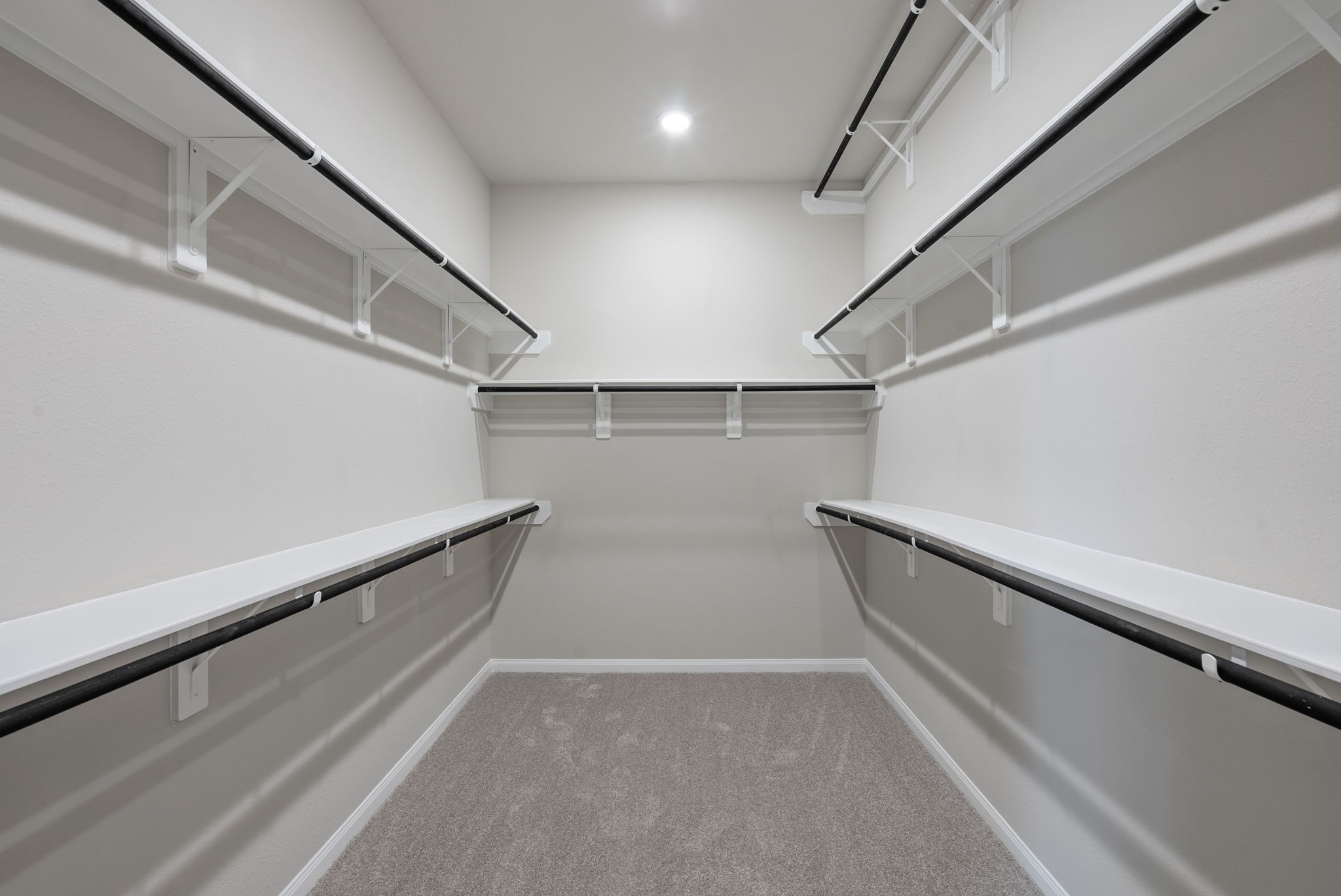 18807 Lima Orange Trail Manvel, TX 77578 - Photo 23 of 32 a view of a room with racks on the wall