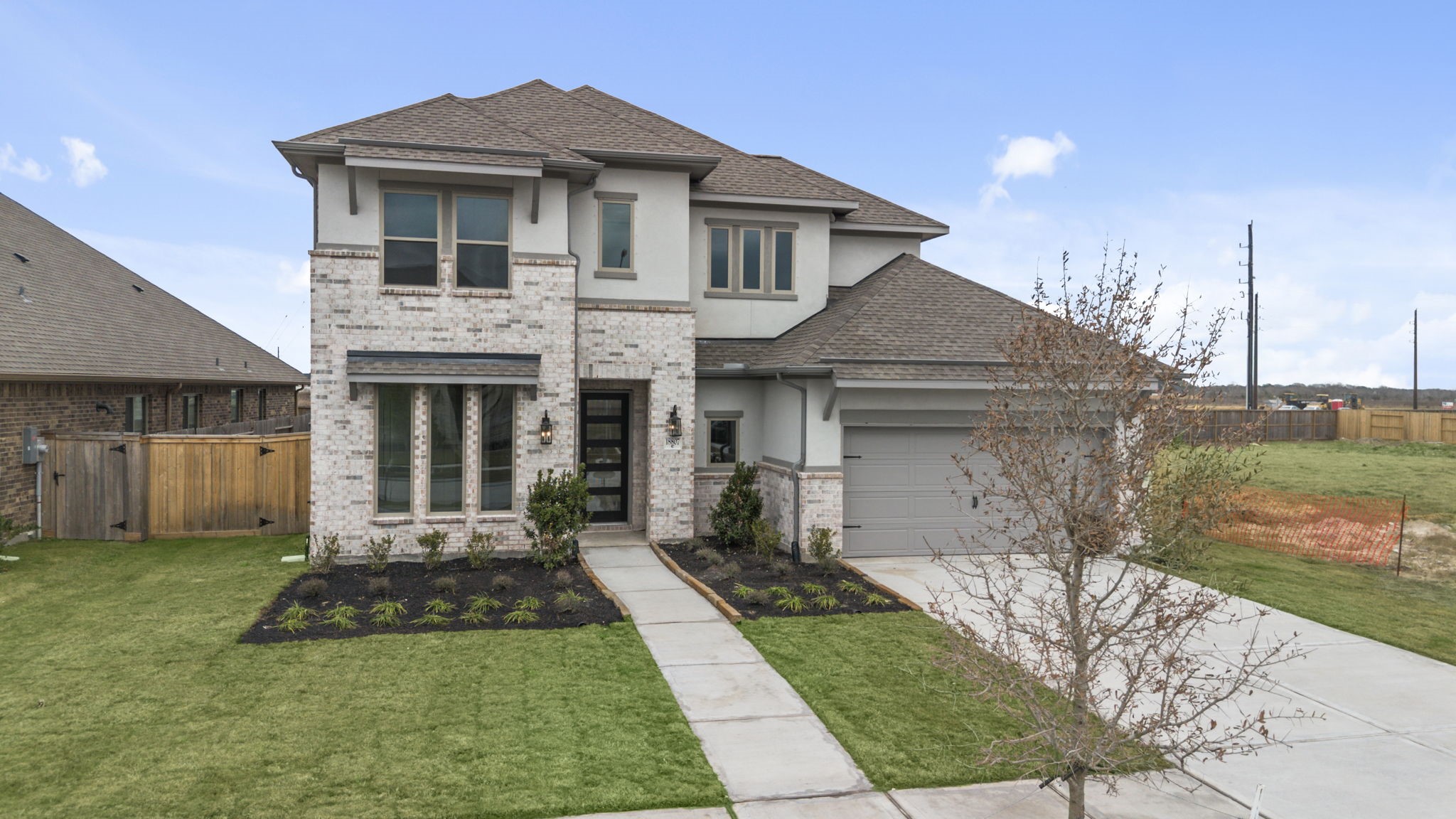 18807 Lima Orange Trail Manvel, TX 77578 - Photo 27 of 32 a front view of a house with a yard