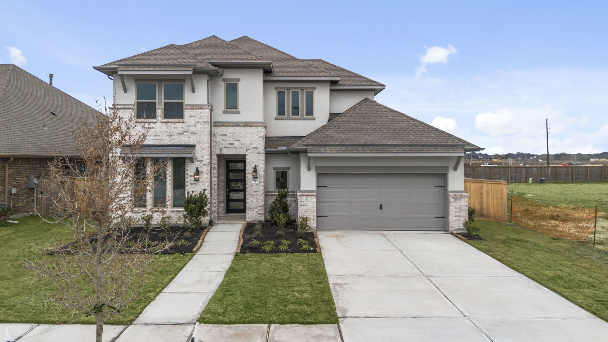 18807 Lima Orange Trail Manvel, TX 77578 - Photo 28 of 32 a front view of a house with a yard