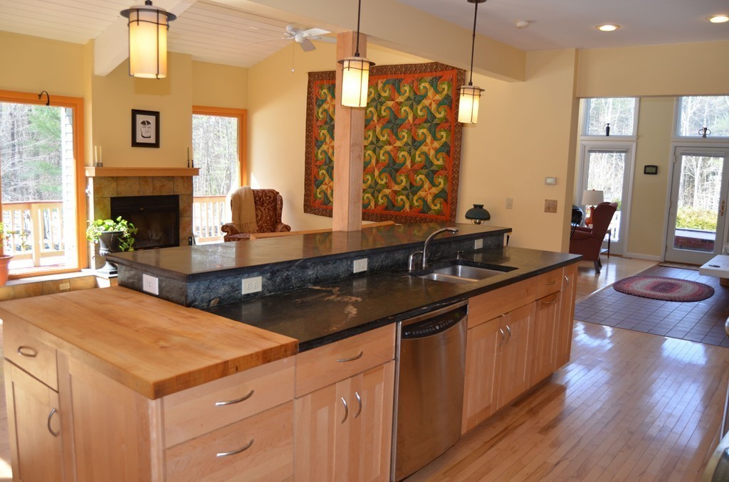48 Meetinghouse Road Pelham, MA 01002 - Photo 14 of 30 a kitchen with stainless steel appliances a sink stove and wooden floor