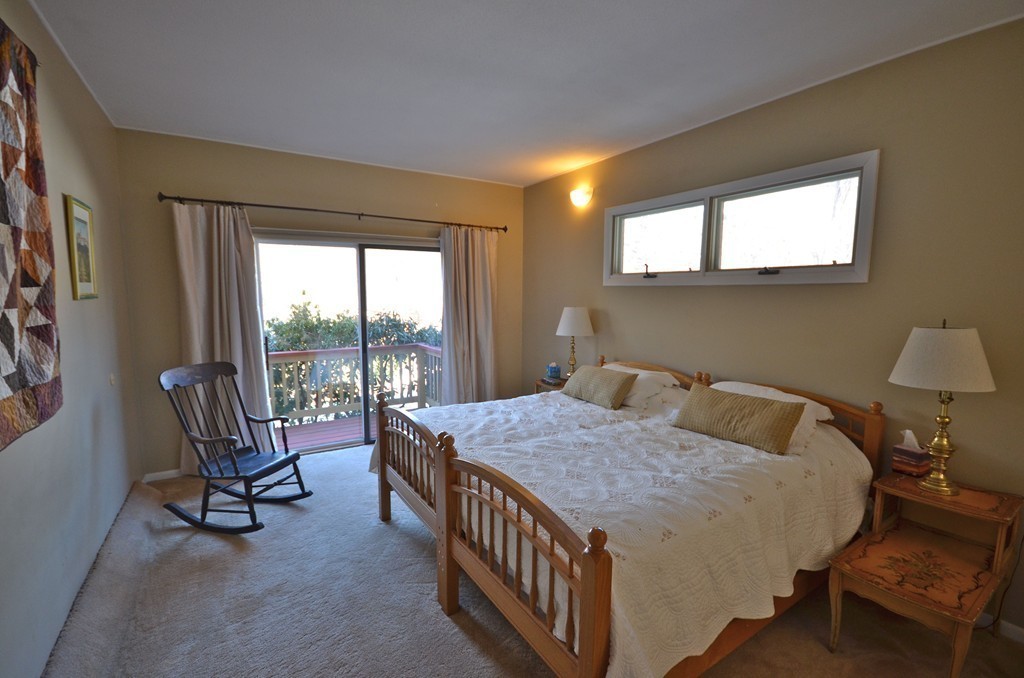 48 Meetinghouse Road Pelham, MA 01002 - Photo 17 of 30 a bedroom with a bed a table and chair