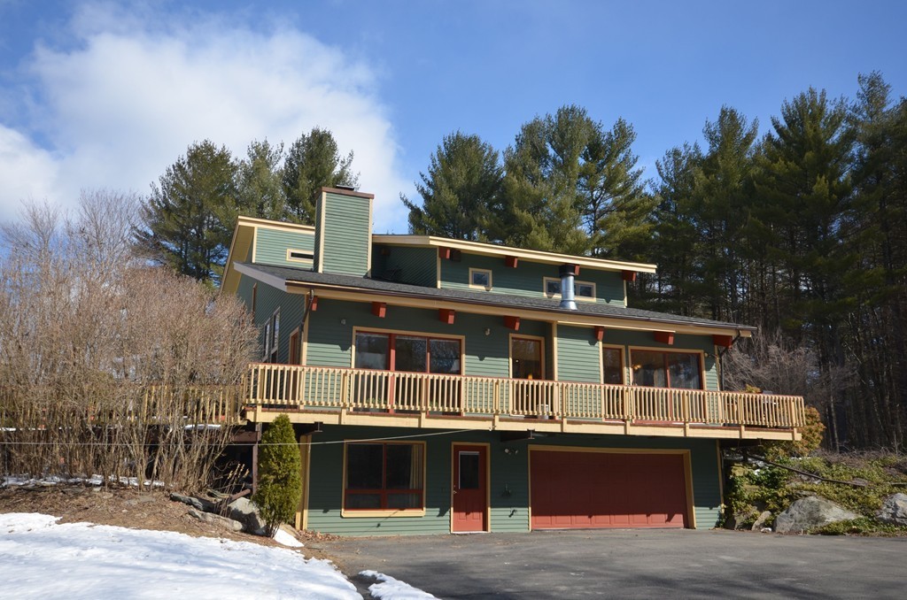 48 Meetinghouse Road Pelham, MA 01002 - Photo 2 of 30 a front view of a house with a balcony