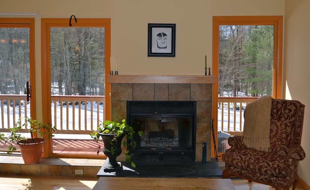 48 Meetinghouse Road Pelham, MA 01002 - Photo 7 of 30 a living room with furniture and a fireplace