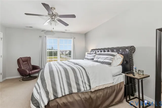 a bedroom with a bed and a couch