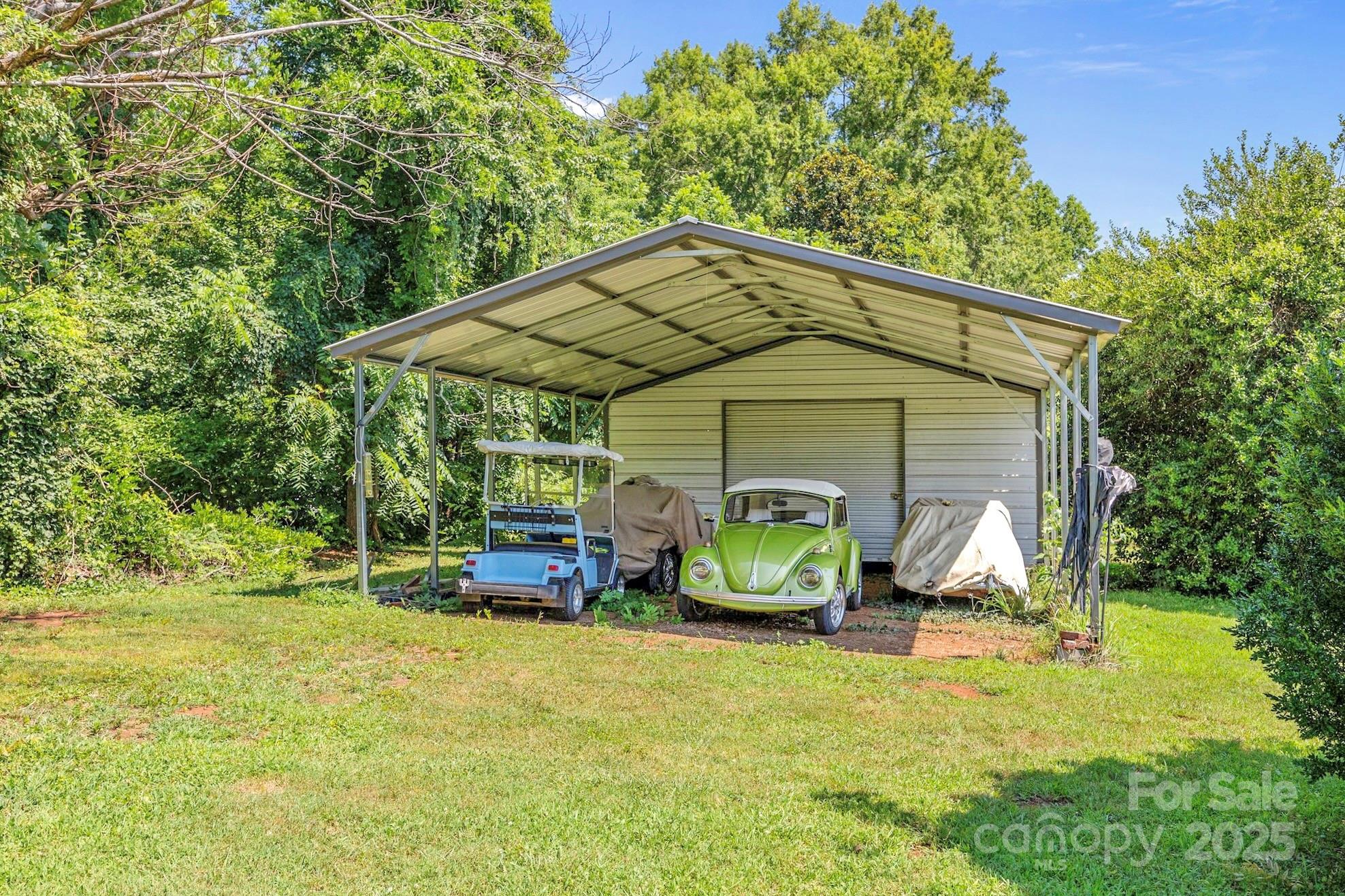 2401 Highway 181 Morganton, NC 28655 - Photo 14 of 17 a front view of a house with garden