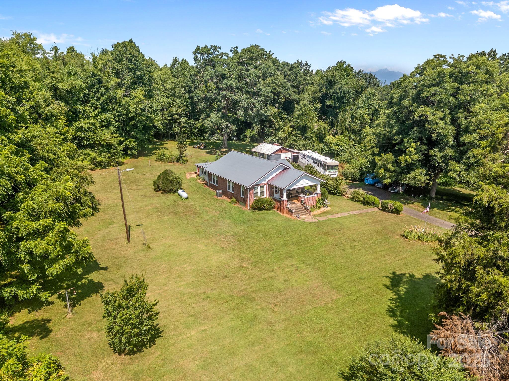 2401 Highway 181 Morganton, NC 28655 - Photo 16 of 17 a view of a houses with a yard