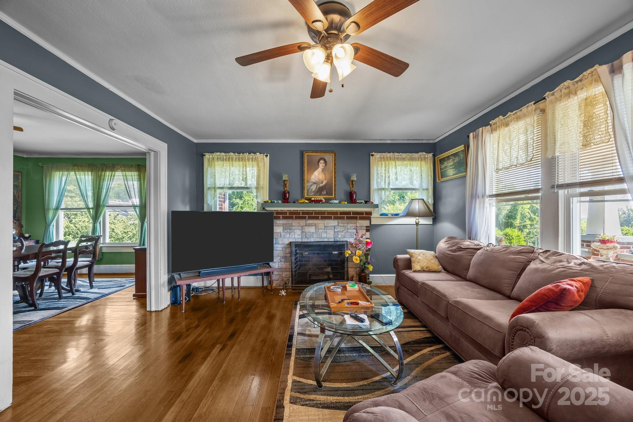 2401 Highway 181 Morganton, NC 28655 - Photo 5 of 17 a living room with furniture and a flat screen tv with wooden floor