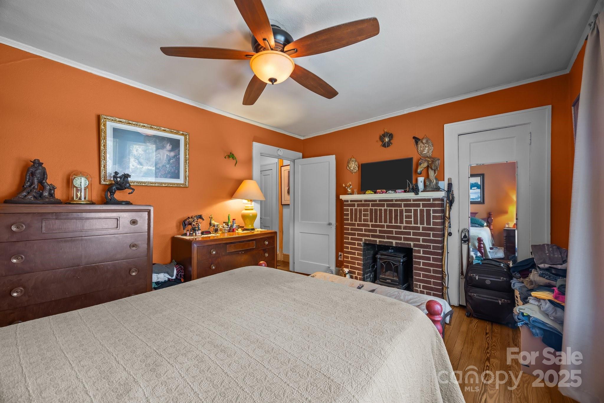 2401 Highway 181 Morganton, NC 28655 - Photo 10 of 17 a bedroom with a bed and a chandelier