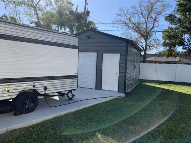 a view of backyard with trampoline