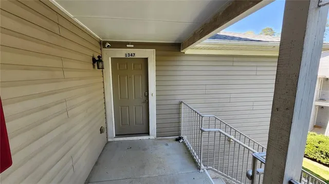 a view of a door and wooden floor