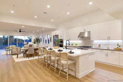 a kitchen with appliances a sink and a counter top space