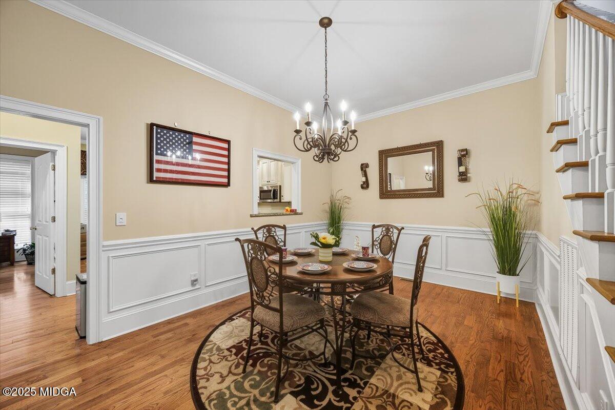 855 Tufthunter Macon, GA 31210 - Photo 13 of 38 a view of a dining room with furniture and wooden floor