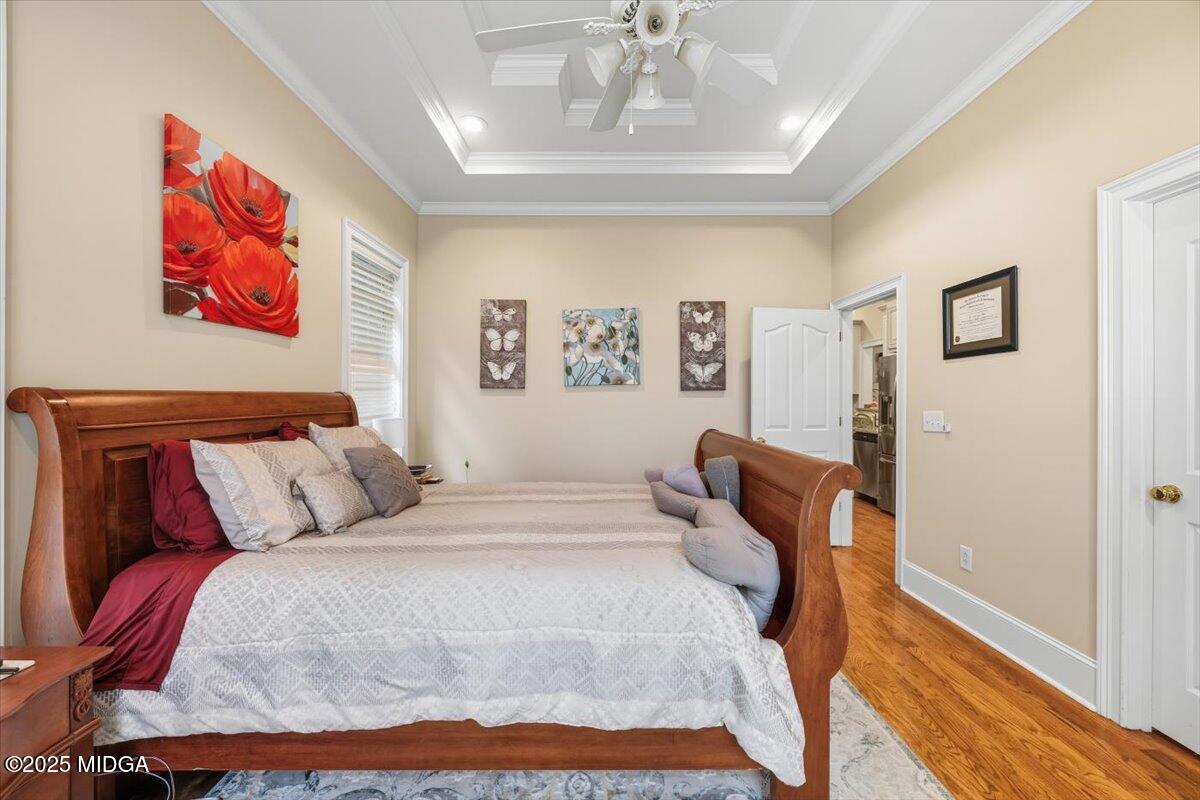 855 Tufthunter Macon, GA 31210 - Photo 19 of 38 a bedroom with a bed and wooden floor